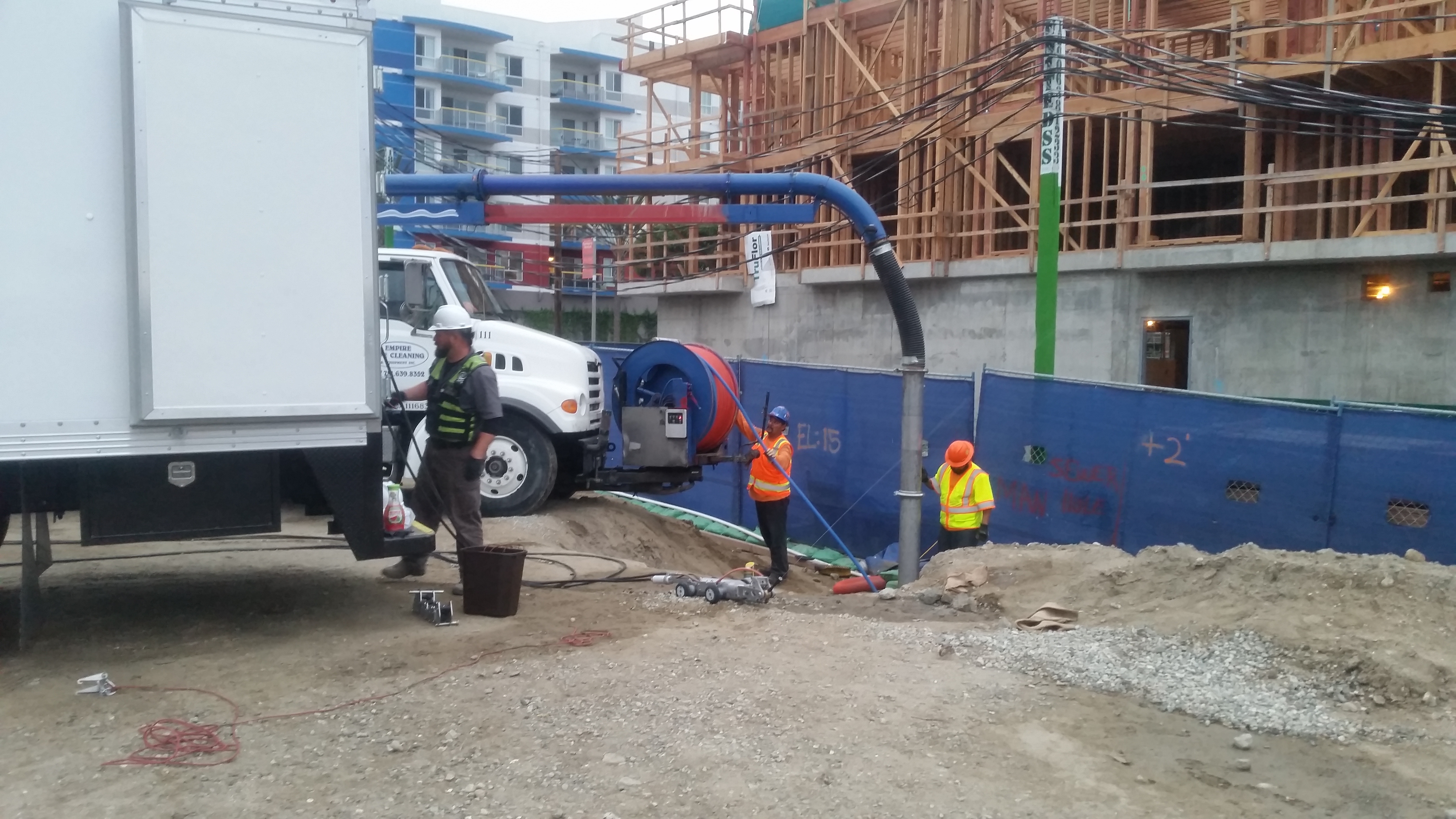 Sewer contractor removes concrete with high pressure water jet